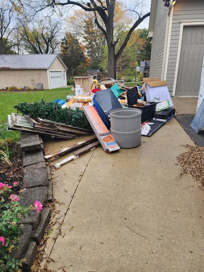 Dumpster being loaded with debris for Commercial Dumpster Rental in East Dundee